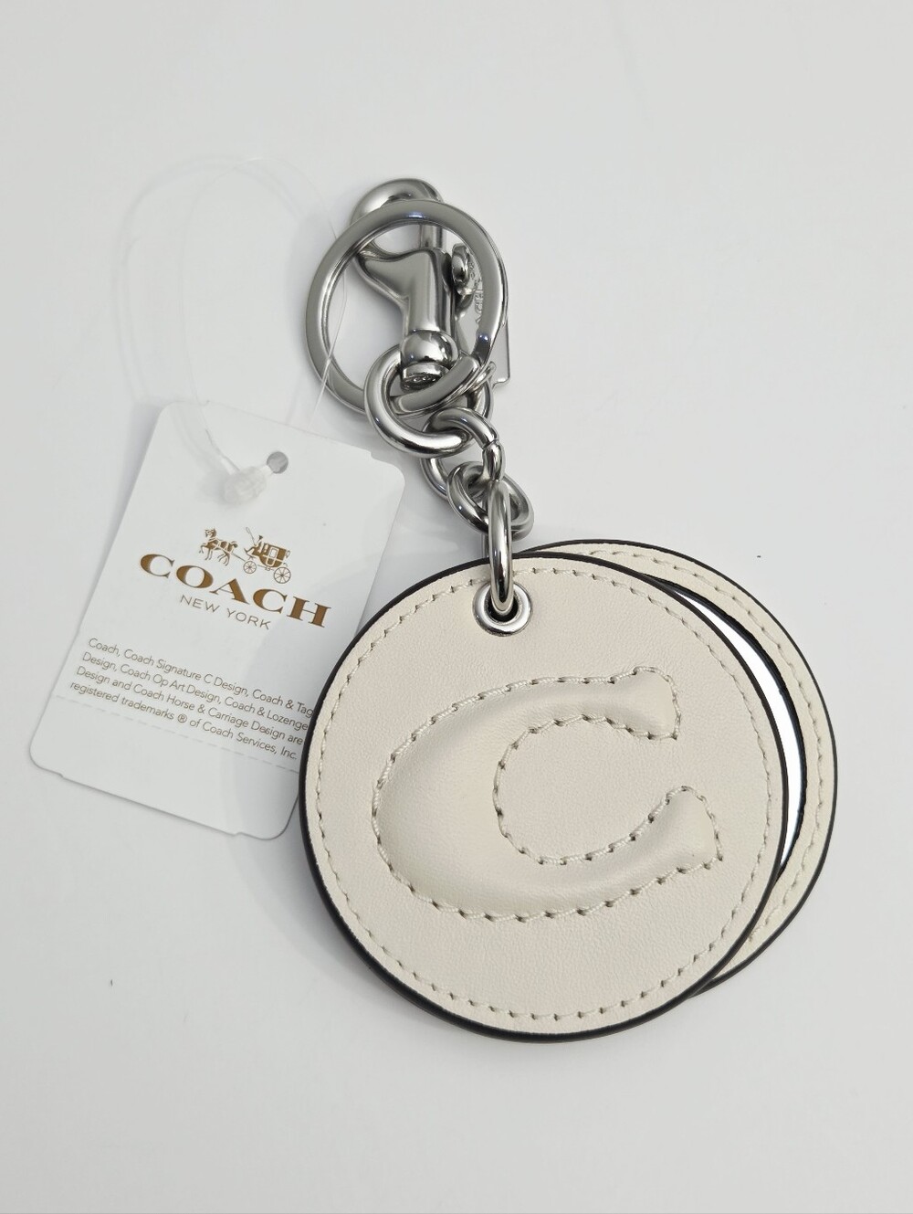 NWT DEBOSSED SCULPTED C MIRROR BAG CHARM - SILVER/CHALK